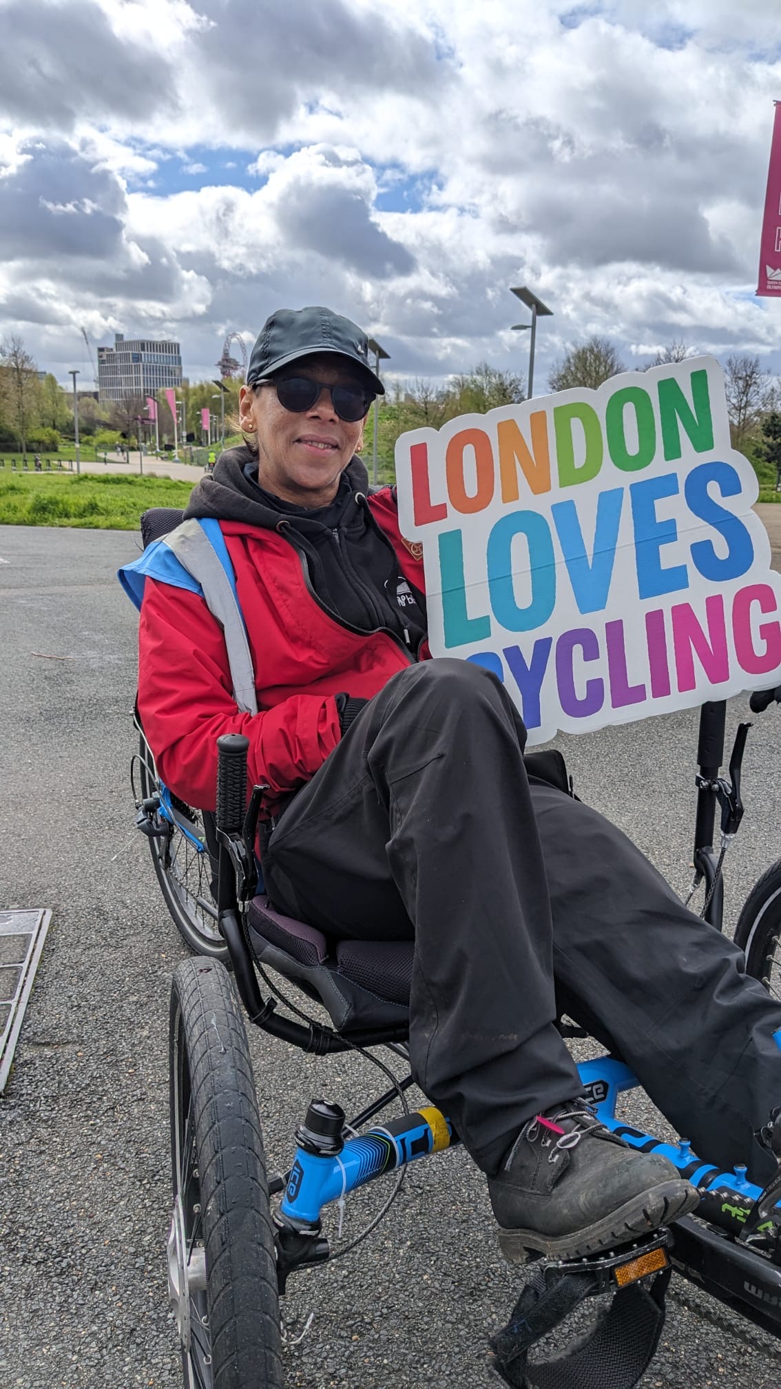 Person on cycle holding up London Loves Cycling sign